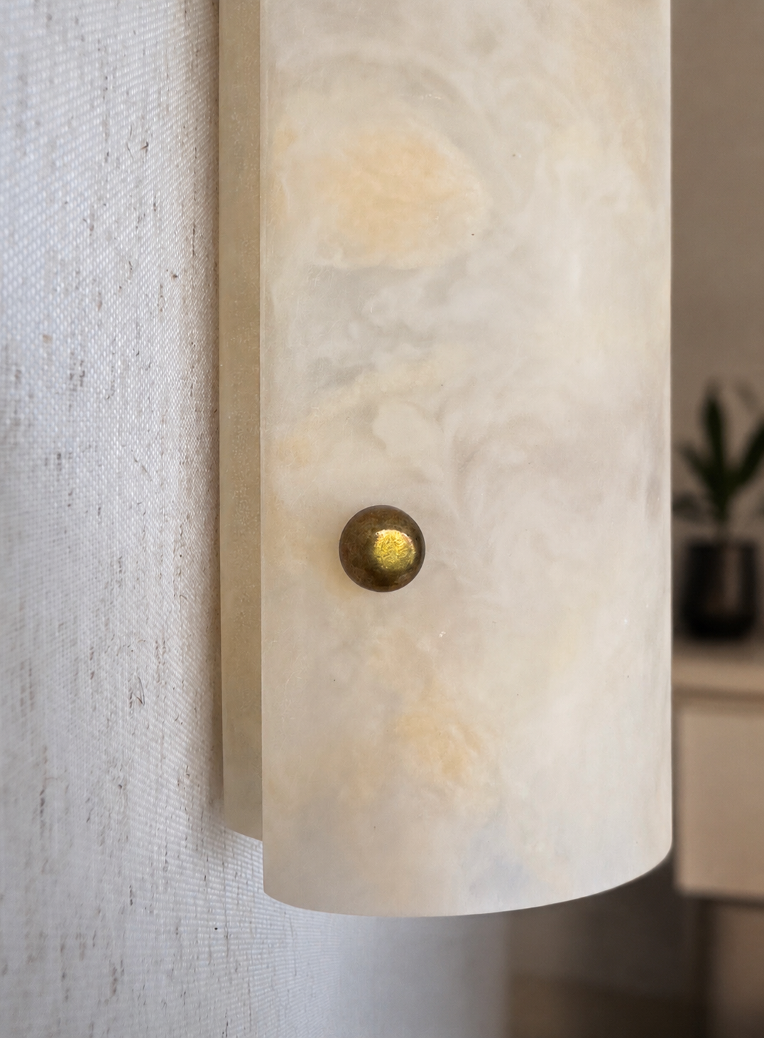 Handmade wireless resin wall sconce with alabaster-inspired finish