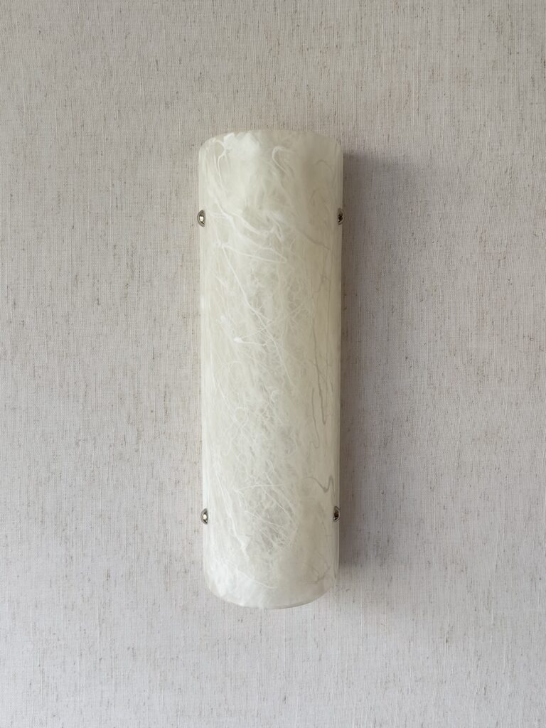 Wireless resin wall sconce with white quartz-inspired finish