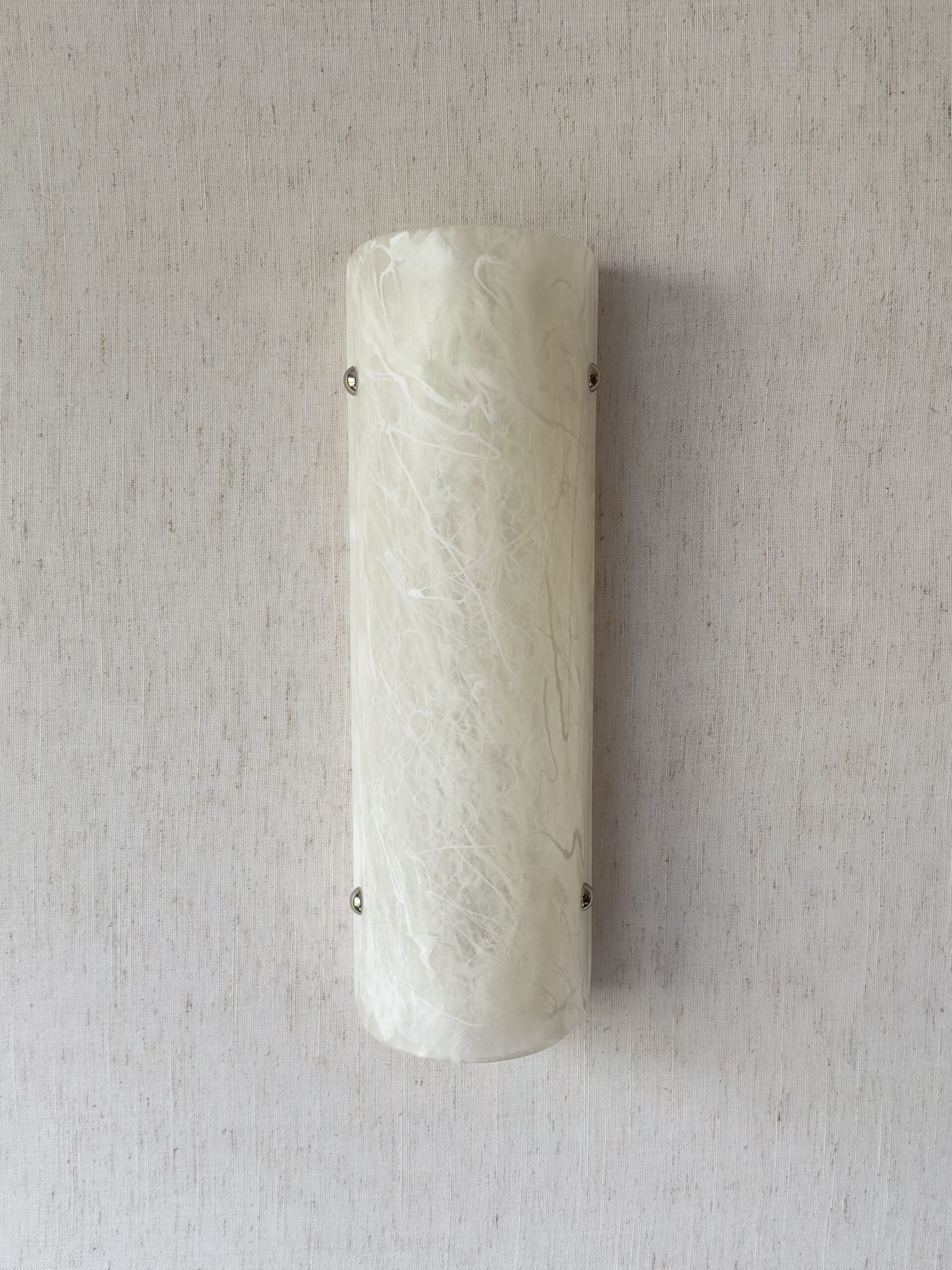 Wireless resin wall sconce with white quartz-inspired finish