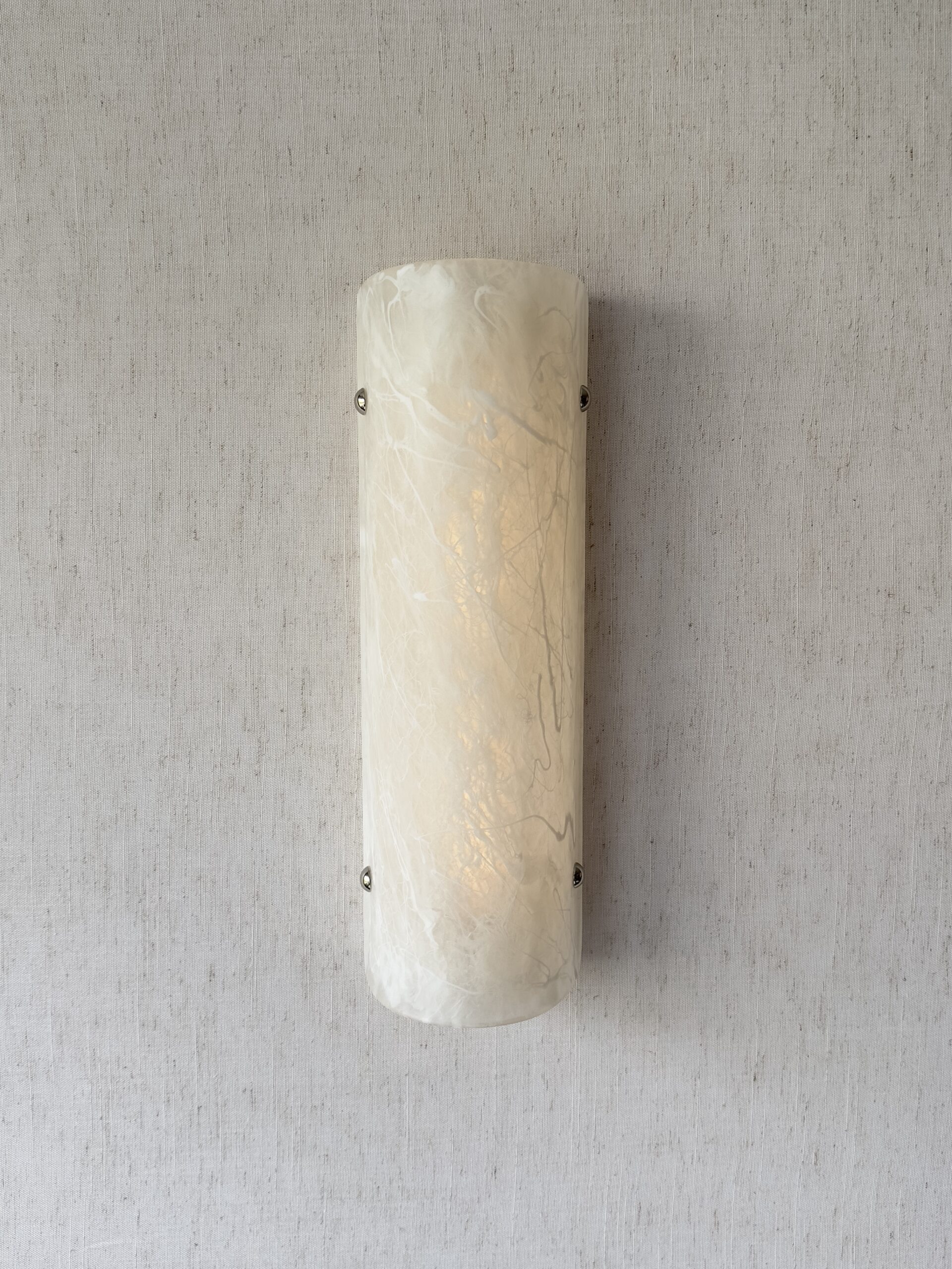 Wireless resin wall sconce with white quartz-inspired finish