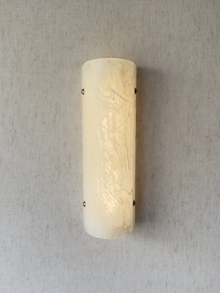 Wireless resin wall sconce with white quartz-inspired finish