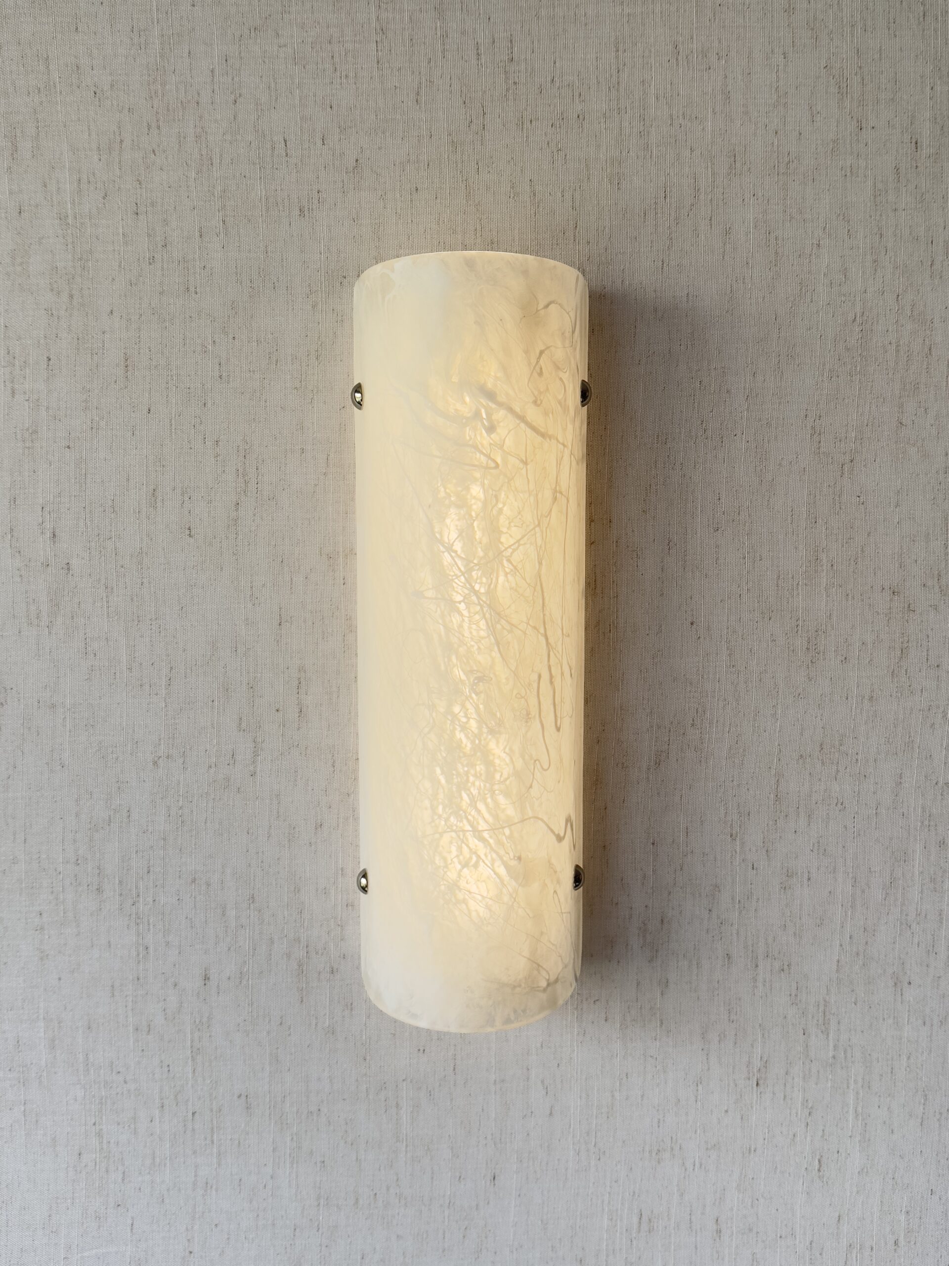 Wireless resin wall sconce with white quartz-inspired finish