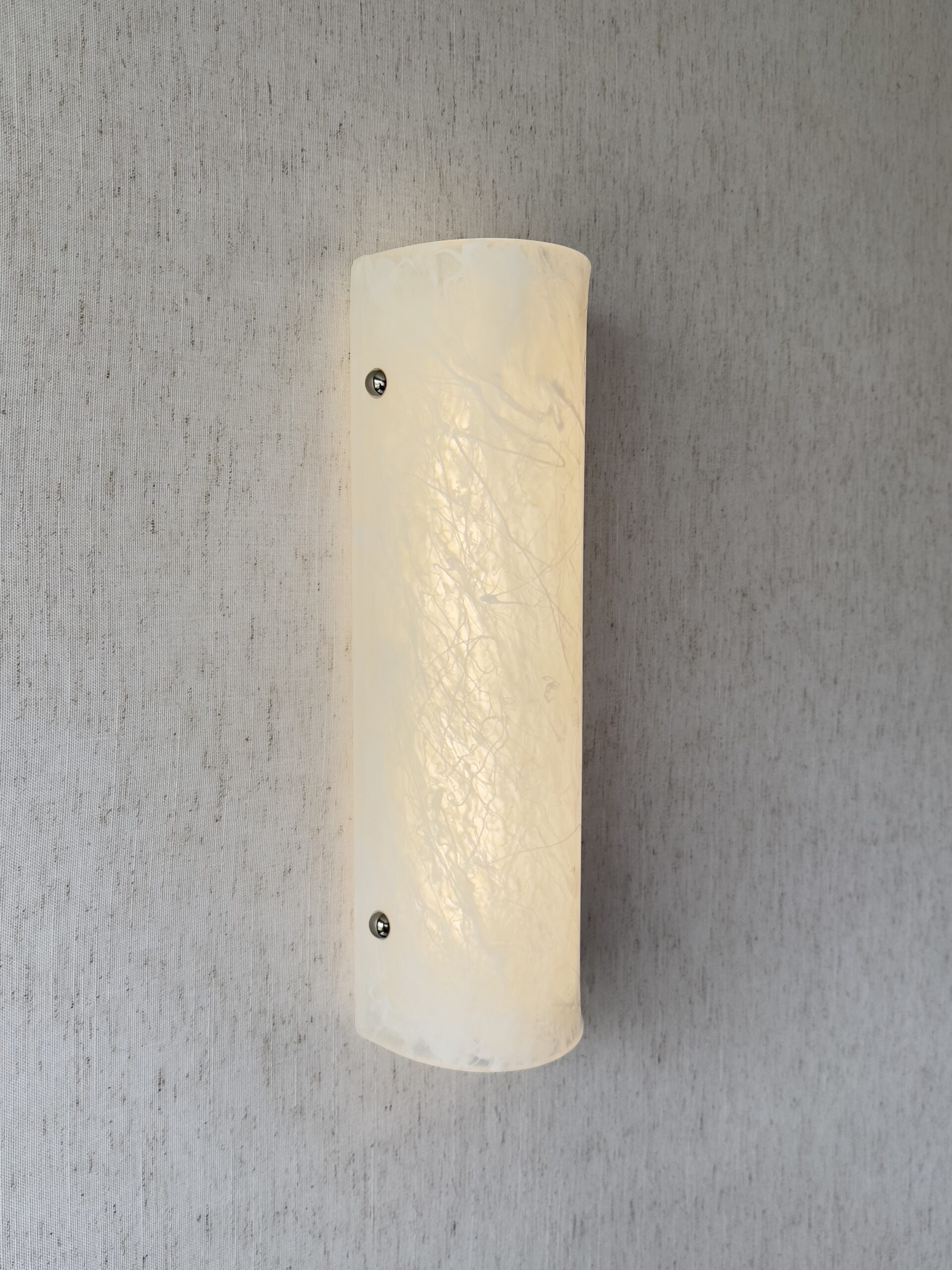 Wireless resin wall sconce with white quartz-inspired finish