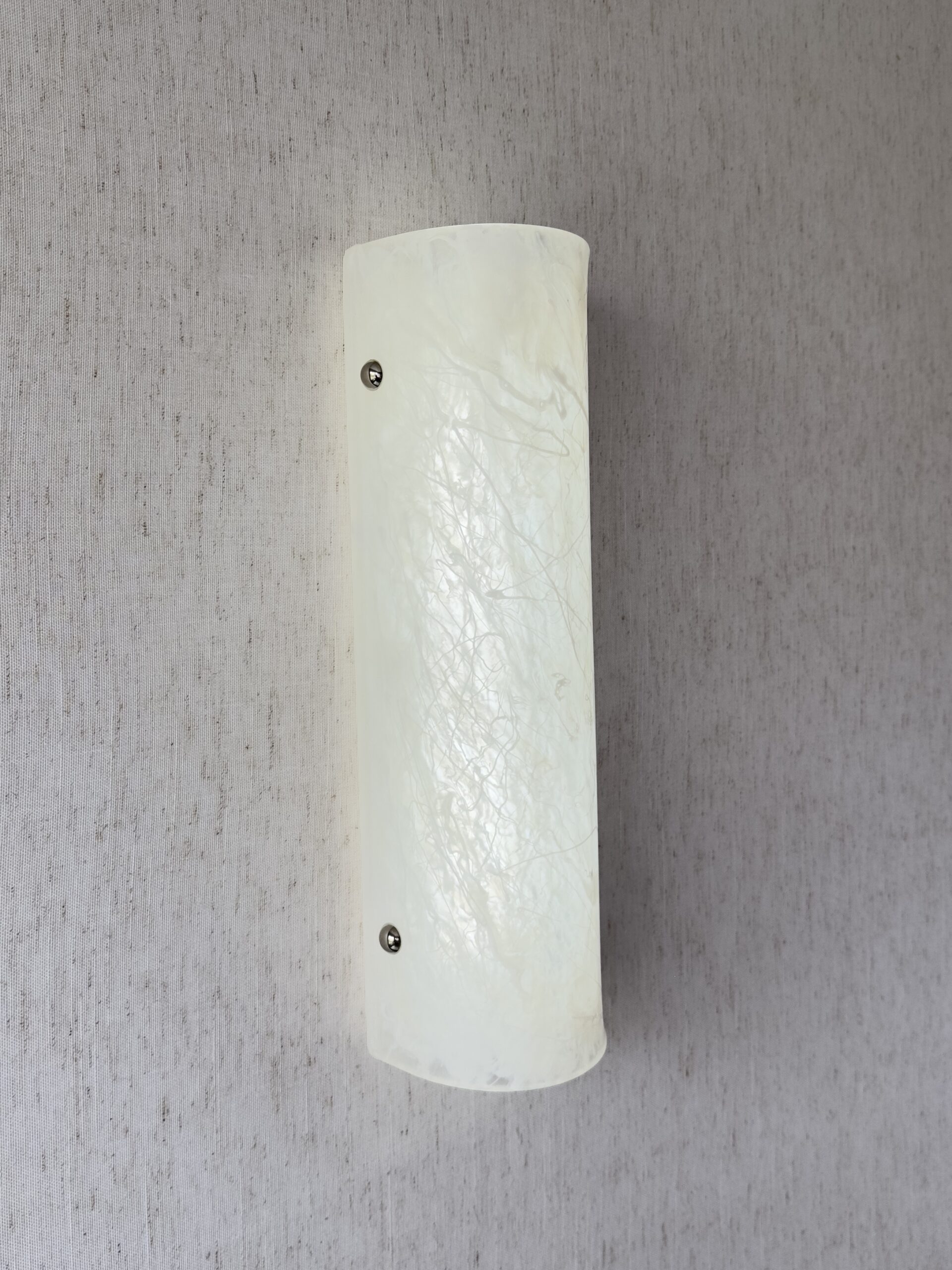 Wireless resin wall sconce with white quartz-inspired finish