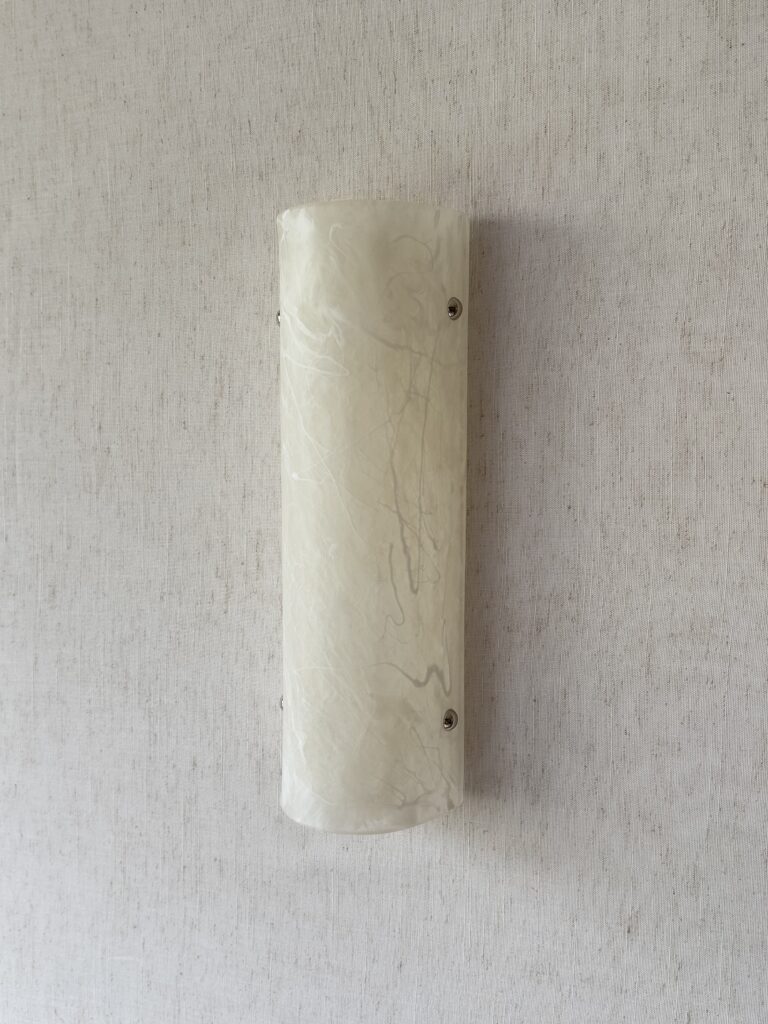 Wireless resin wall sconce with white quartz-inspired finish