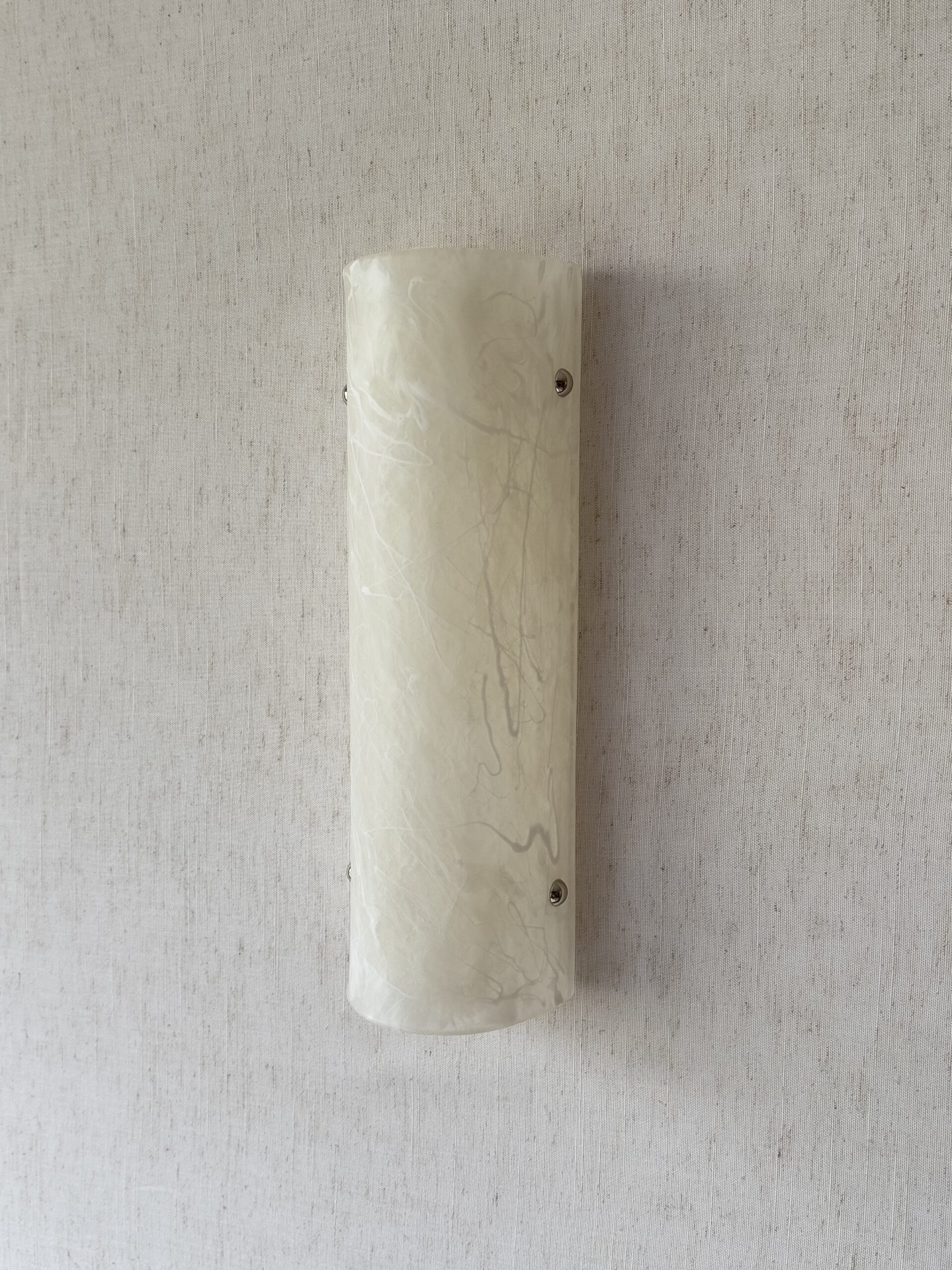 Wireless resin wall sconce with white quartz-inspired finish