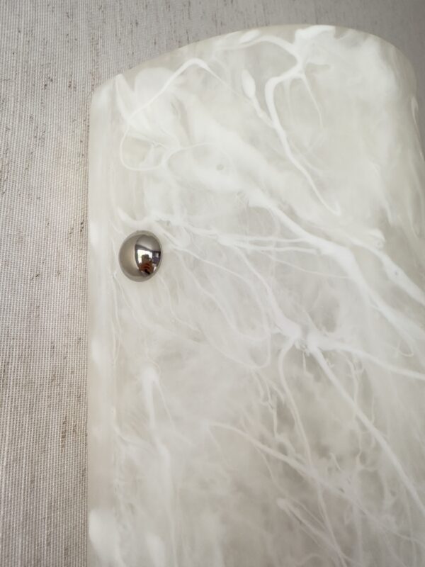 Wireless resin wall sconce with white quartz-inspired finish
