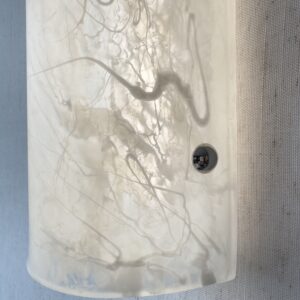Wireless resin wall sconce with white quartz-inspired finish