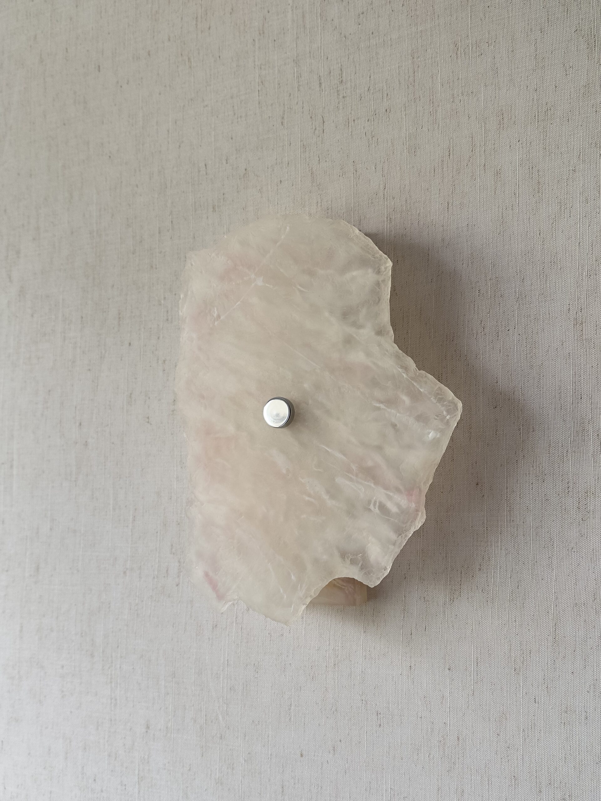 Wireless resin wall sconce with white quartz-inspired finish