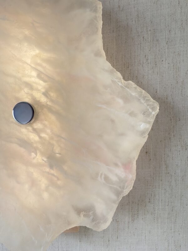 Wireless resin wall sconce with white quartz-inspired finish