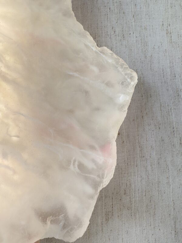Wireless resin wall sconce with white quartz-inspired finish