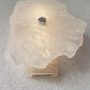 Wireless resin wall sconce with white quartz-inspired finish