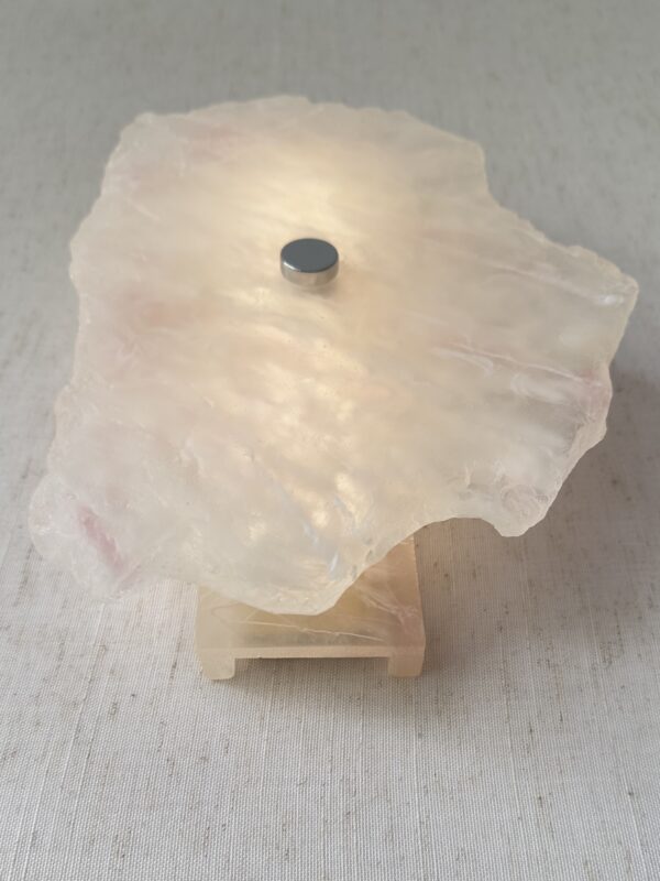 Wireless resin wall sconce with white quartz-inspired finish