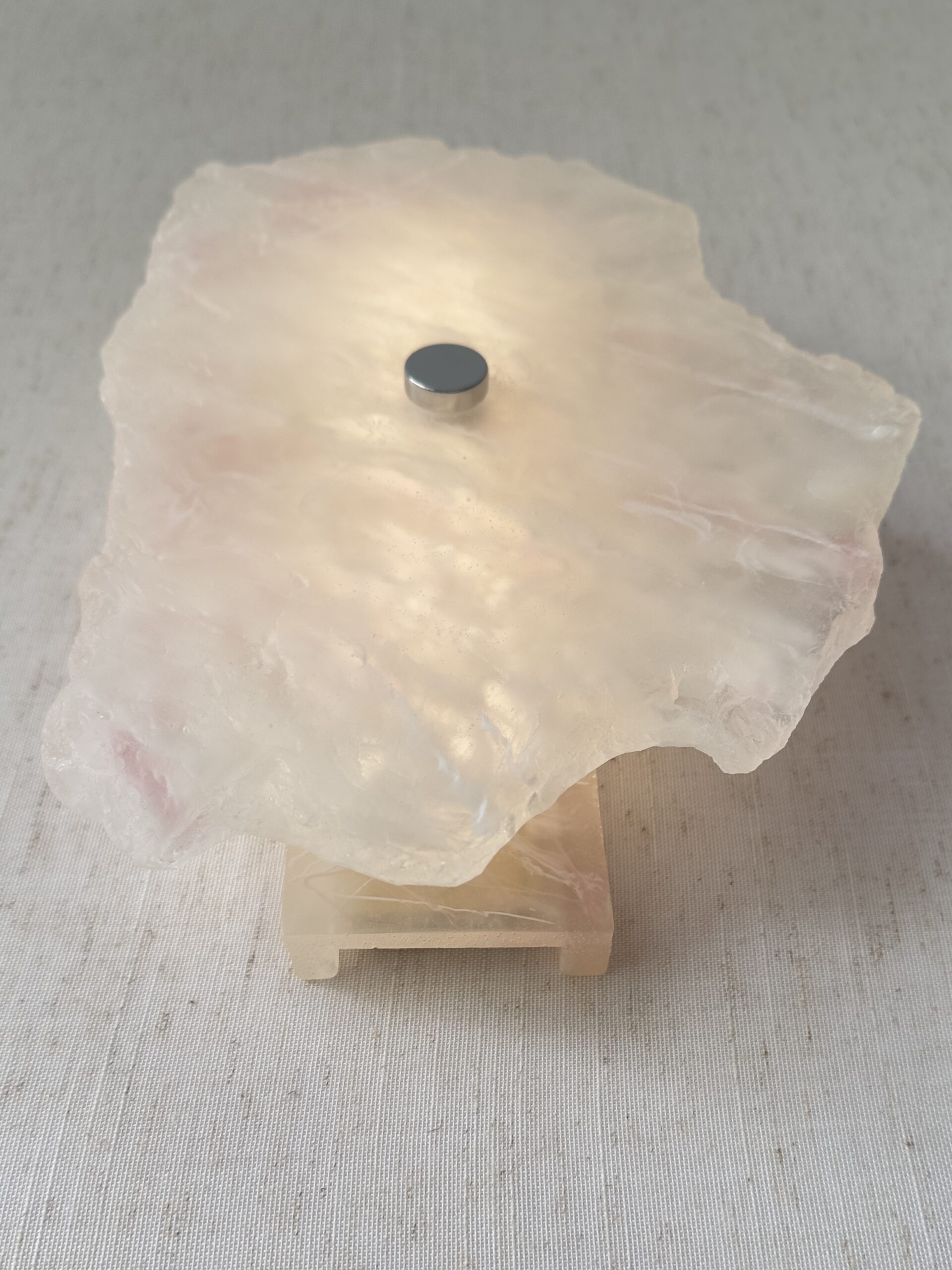 Wireless resin wall sconce with white quartz-inspired finish