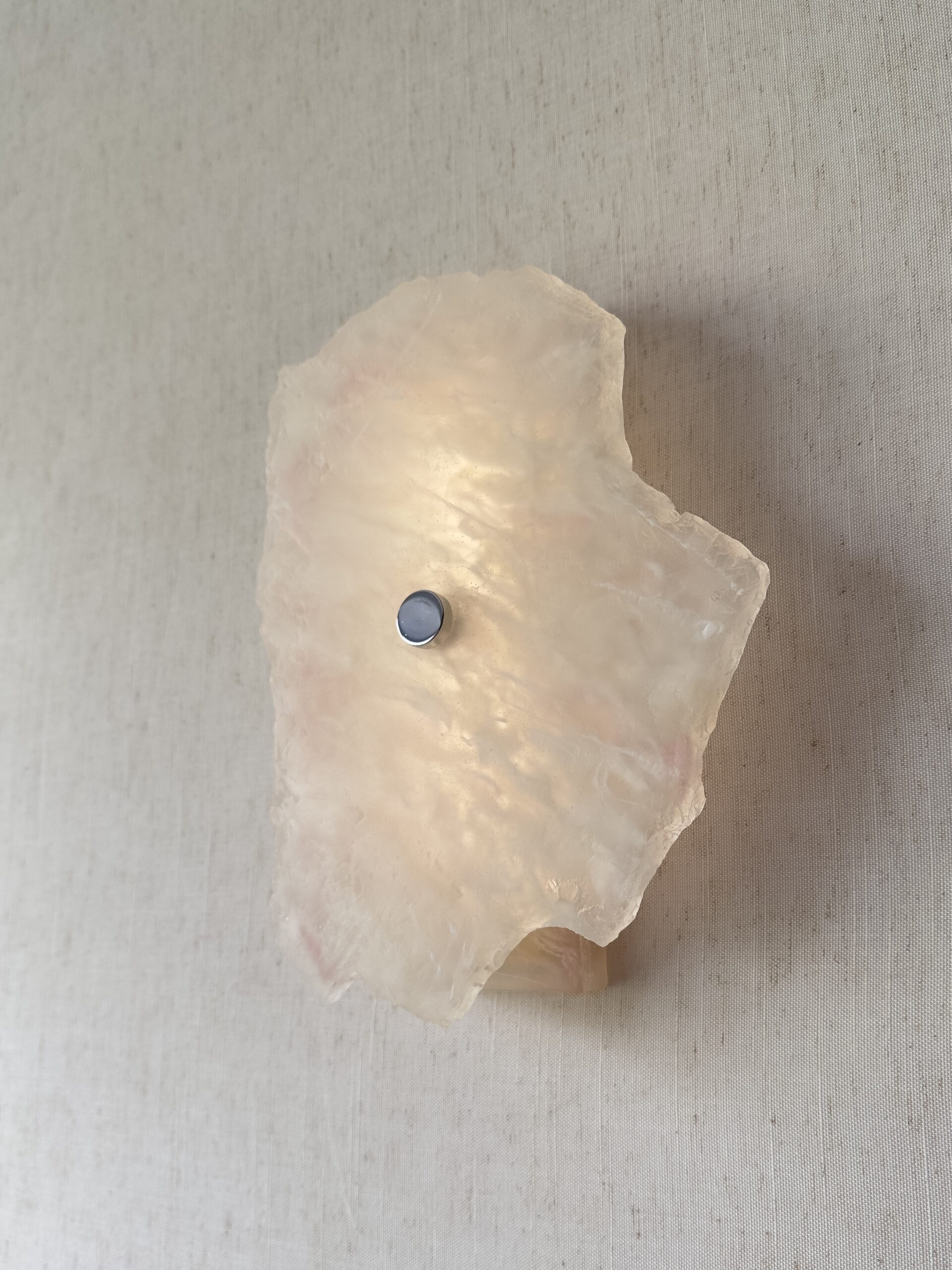 Wireless resin wall sconce with white quartz-inspired finish