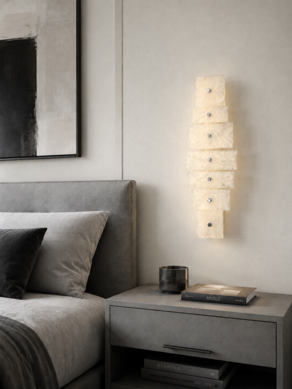 Wireless resin wall sconce with white quartz-inspired finish
