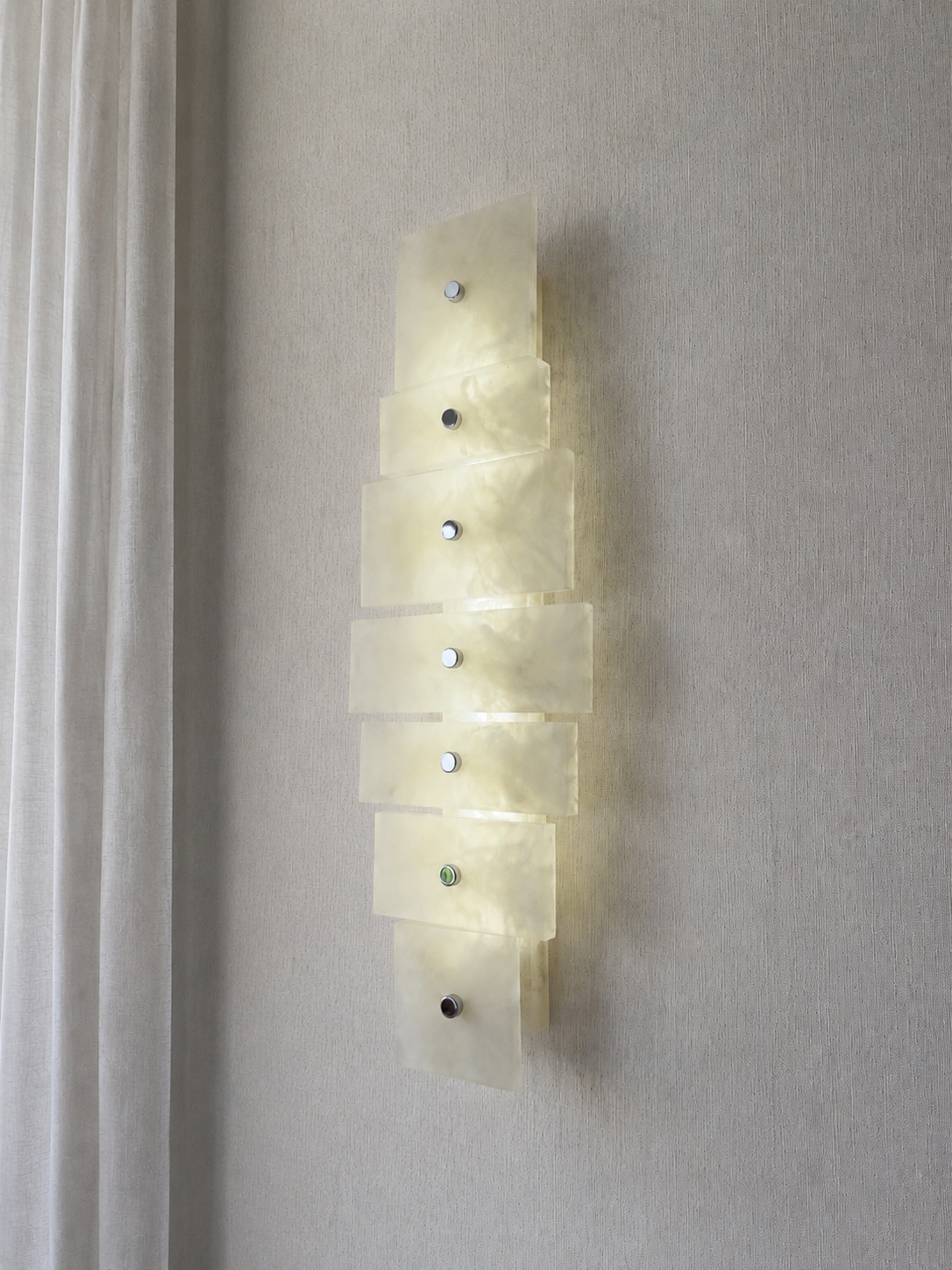 Wireless resin wall sconce with white quartz-inspired finish