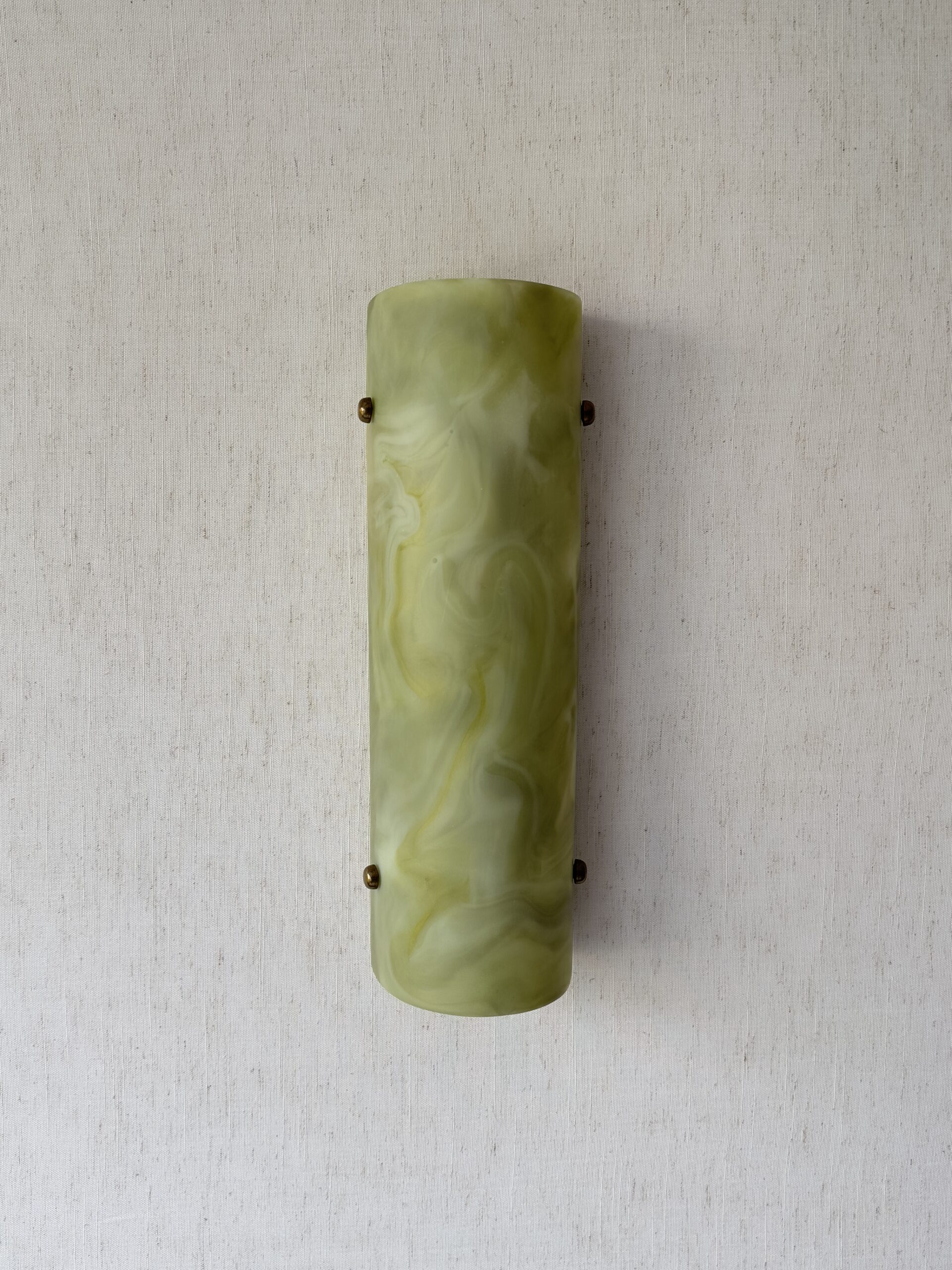 Wireless resin wall sconce inspired by green onyx stone