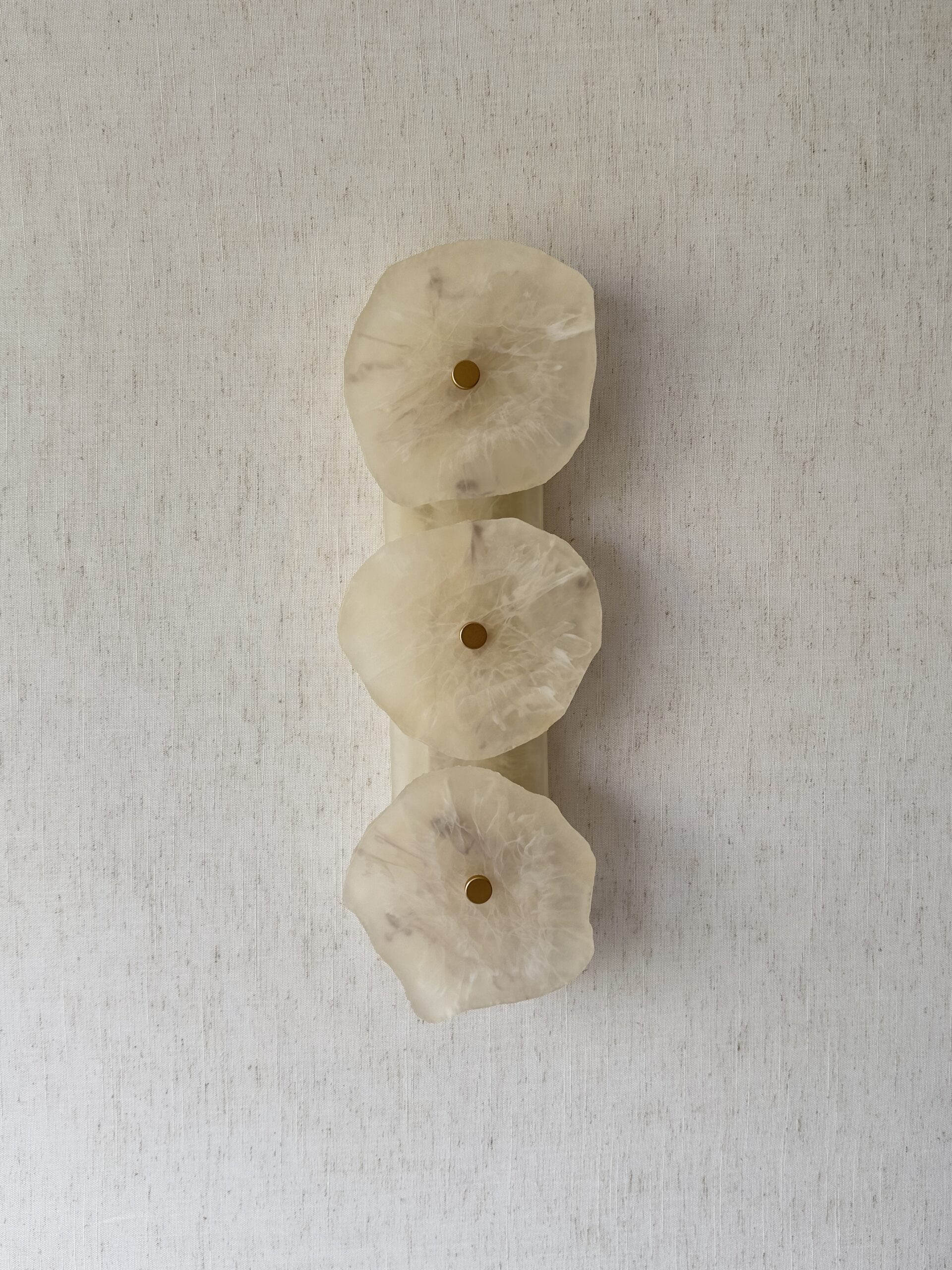 Handmade wireless resin wall sconce with alabaster-inspired finish
