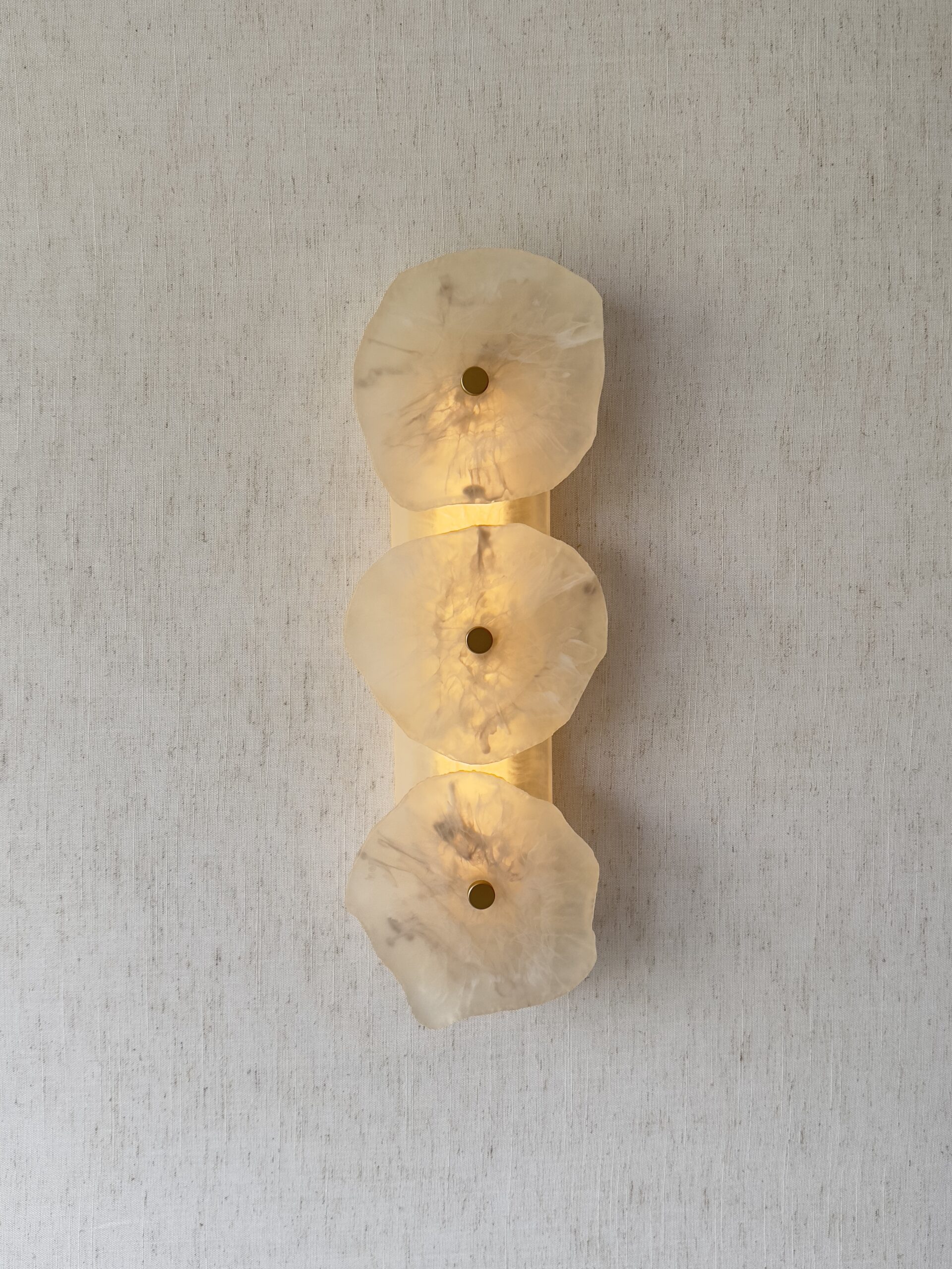 Handmade wireless resin wall sconce with alabaster-inspired finish