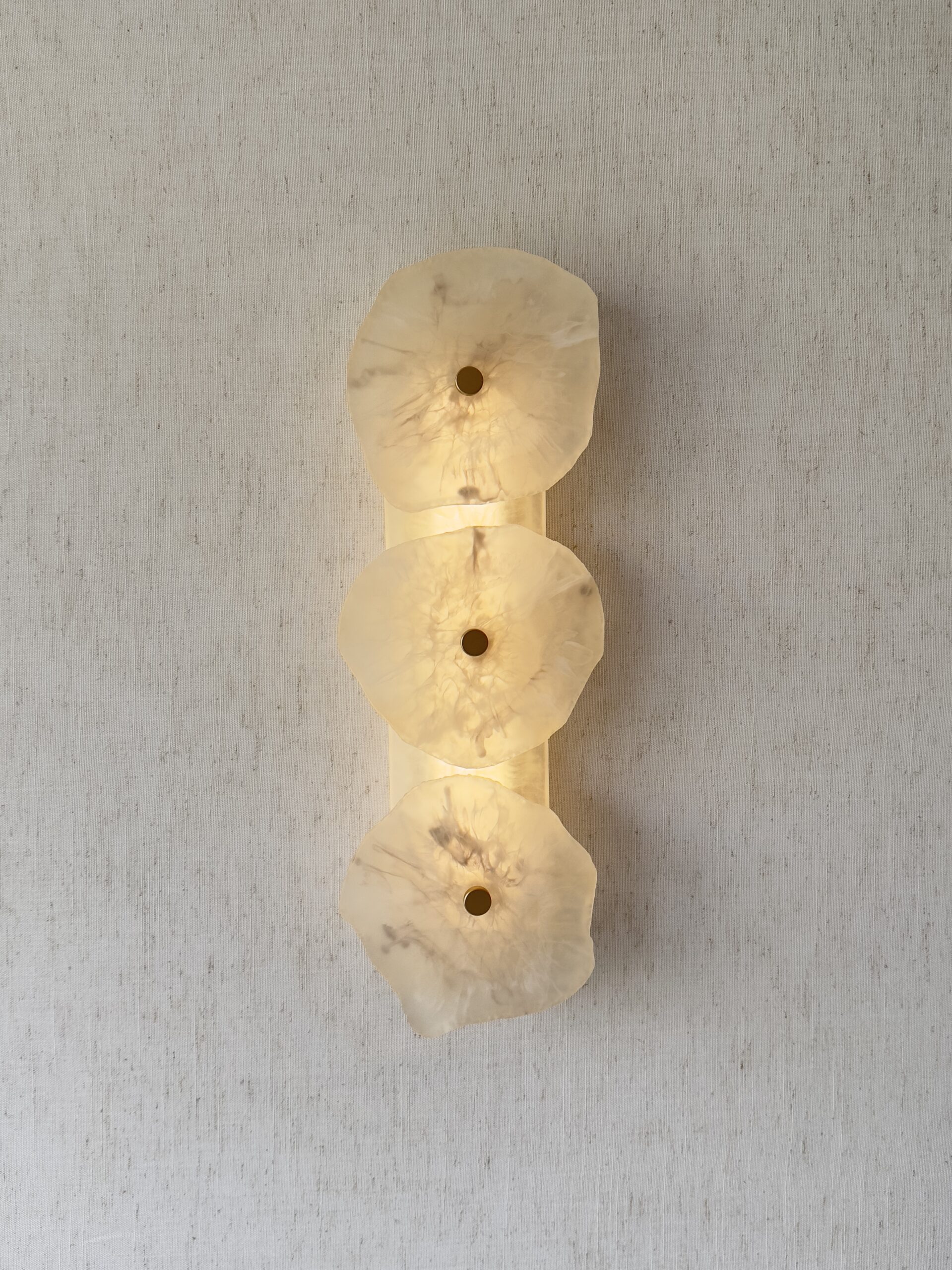 Handmade wireless resin wall sconce with alabaster-inspired finish