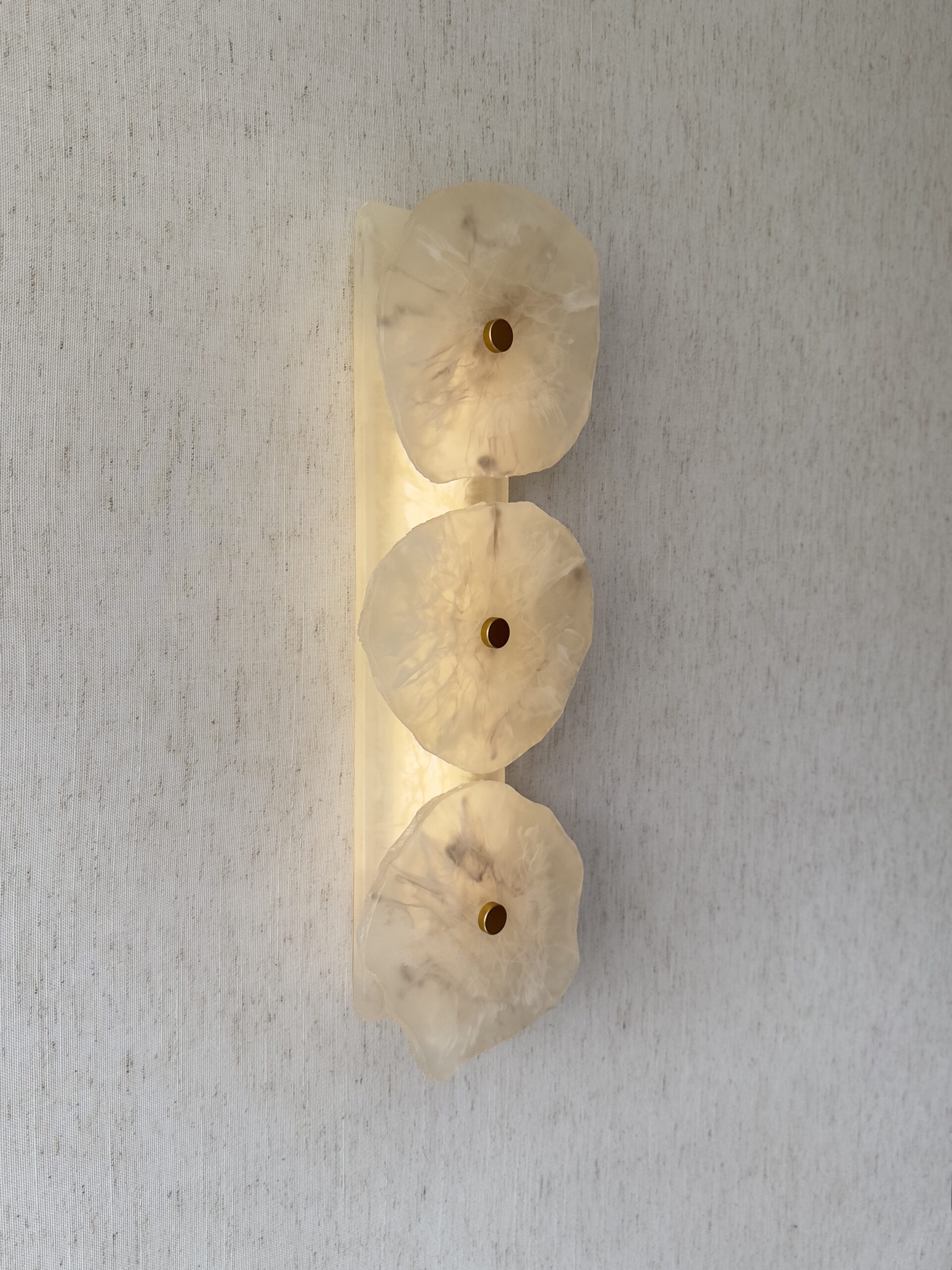 Handmade wireless resin wall sconce with alabaster-inspired finish