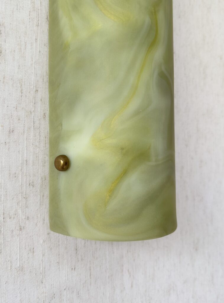 Wireless resin wall sconce inspired by green onyx stone