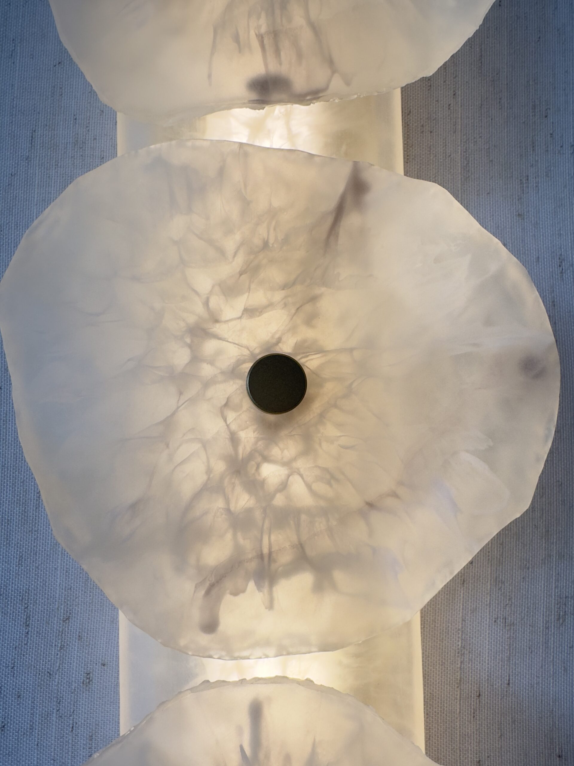 Handmade wireless resin wall sconce with alabaster-inspired finish