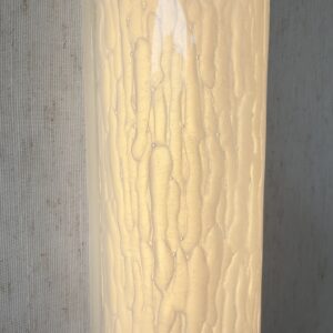 Large vertical wireless resin wall light with sculptural form