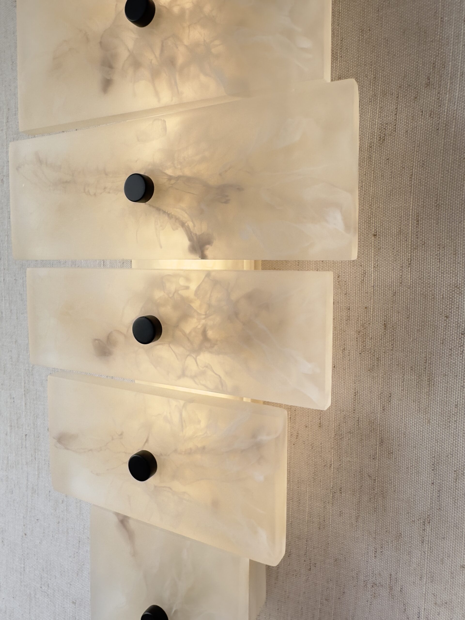 Handmade wireless resin wall sconce with alabaster-inspired finish
