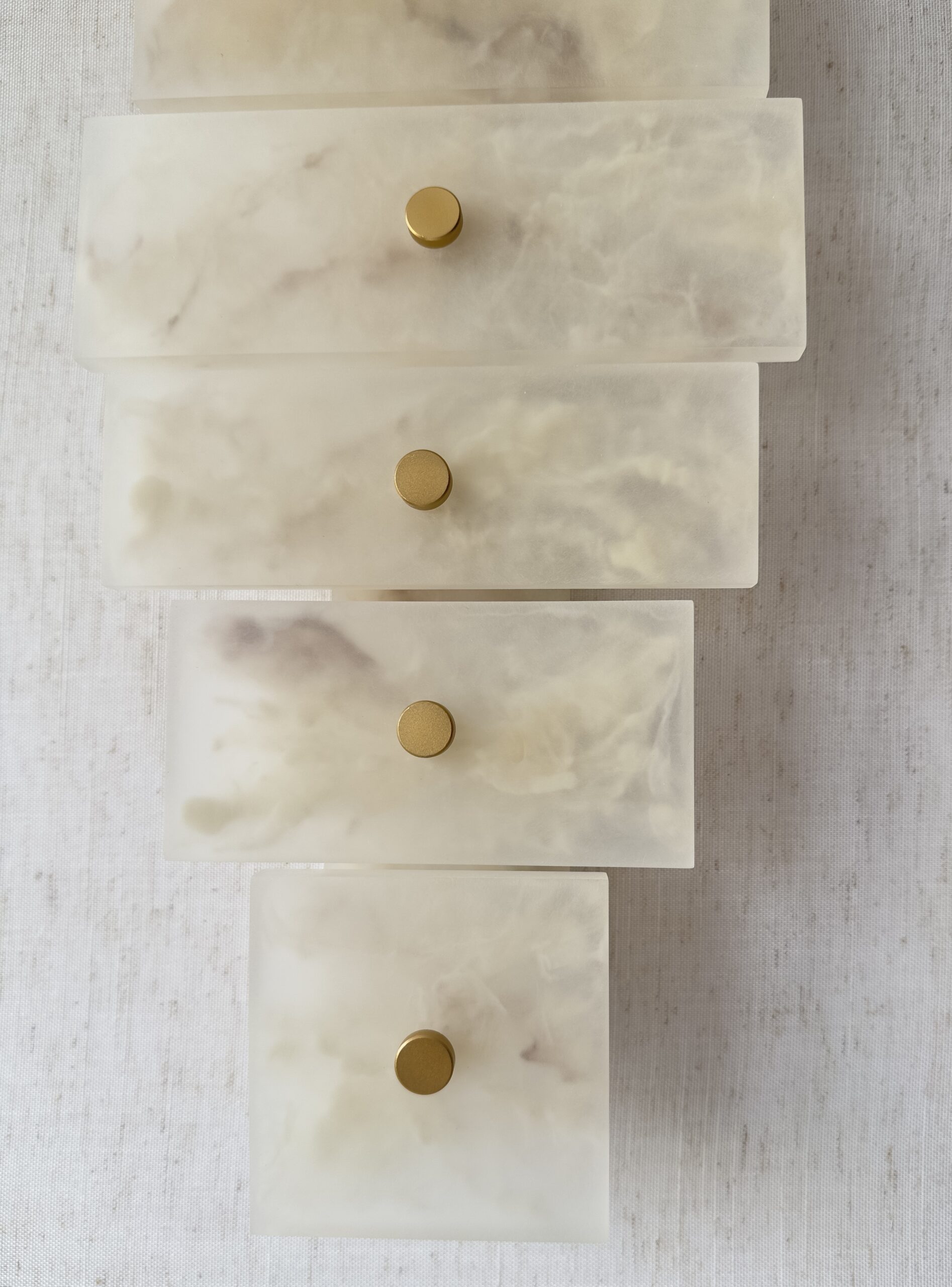 Handmade wireless resin wall sconce with alabaster-inspired finish