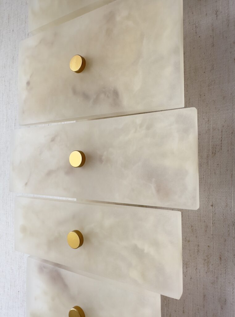 Handmade wireless resin wall sconce with alabaster-inspired finish