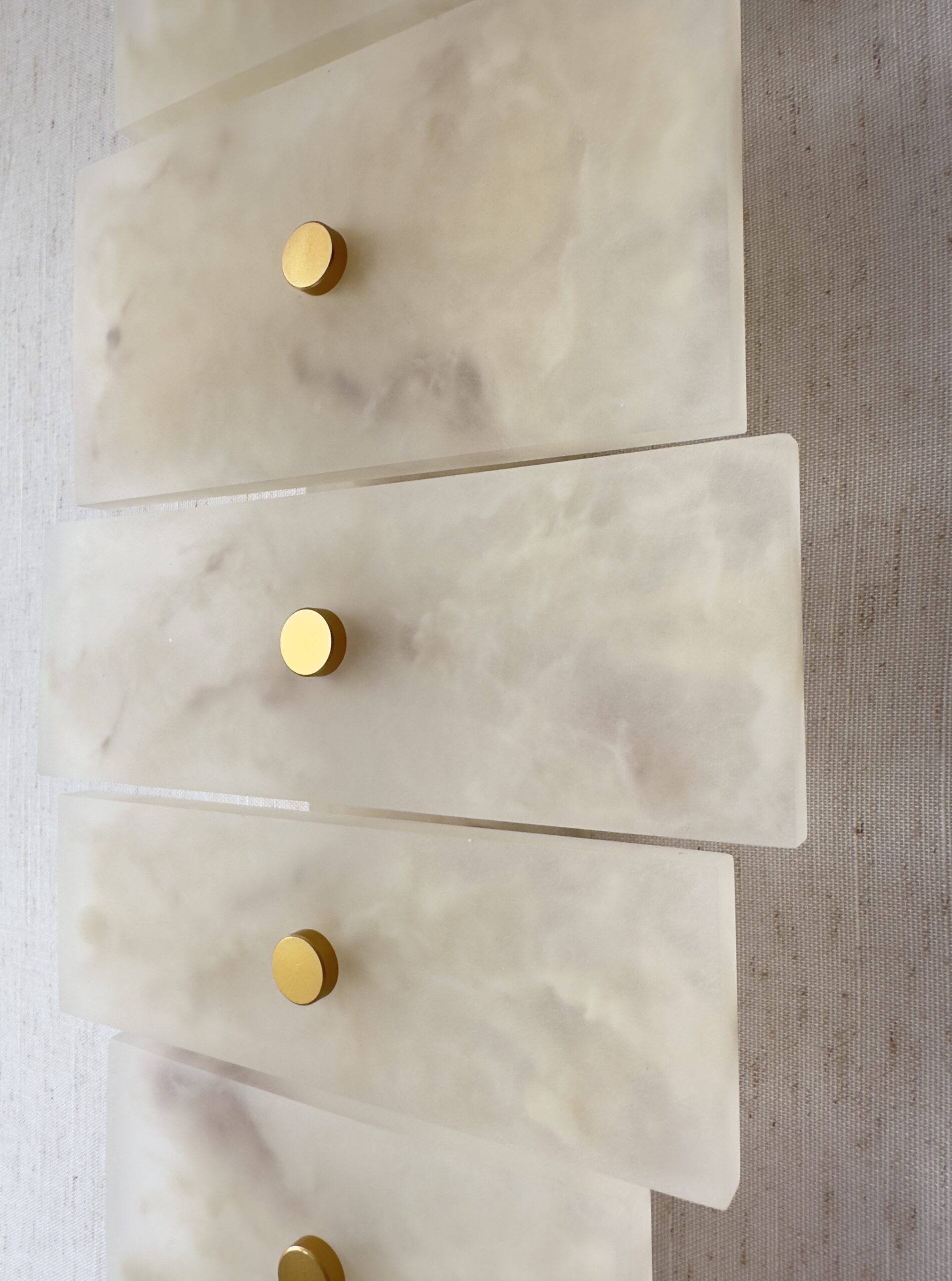 Handmade wireless resin wall sconce with alabaster-inspired finish