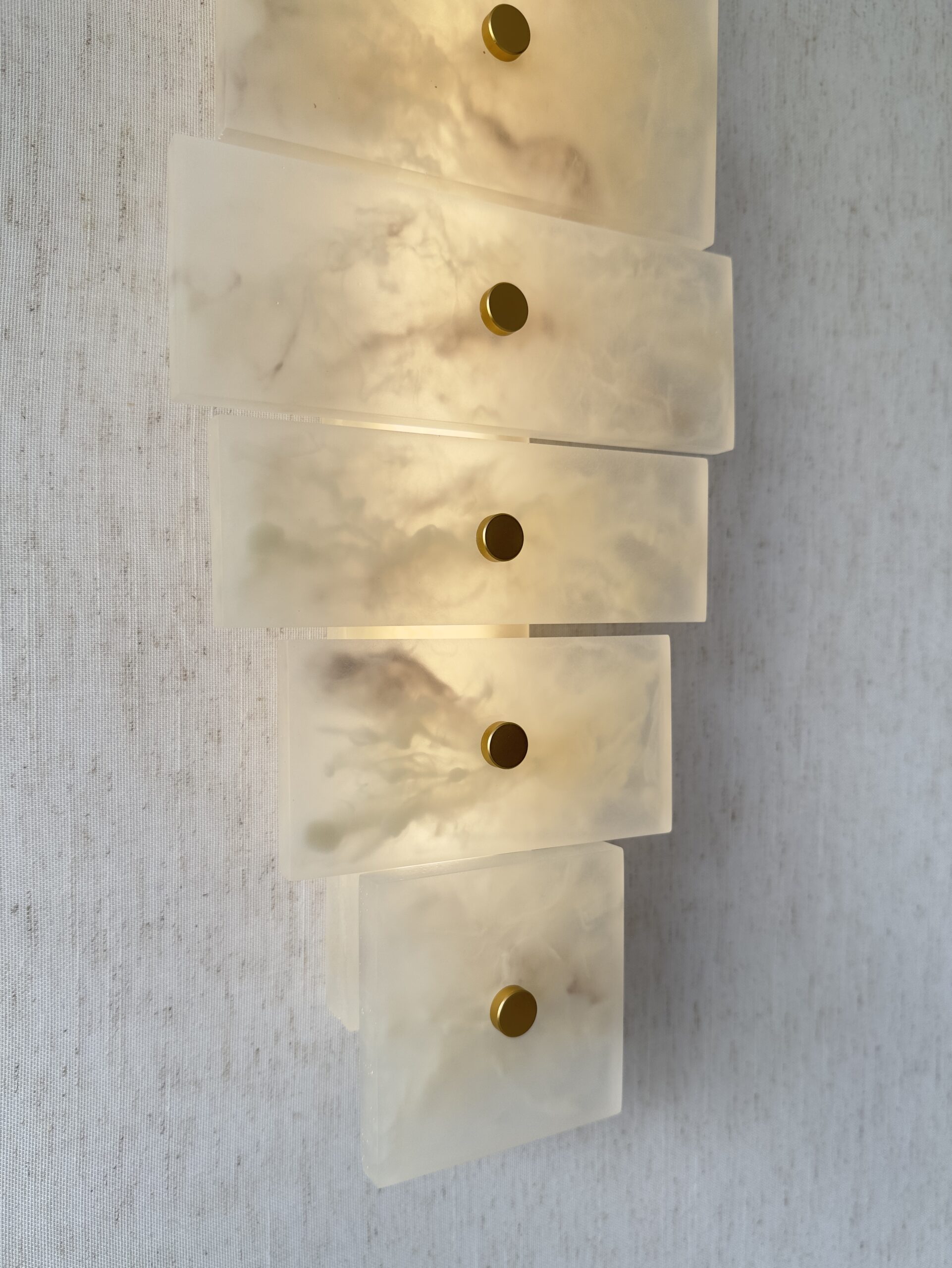 Handmade wireless resin wall sconce with alabaster-inspired finish