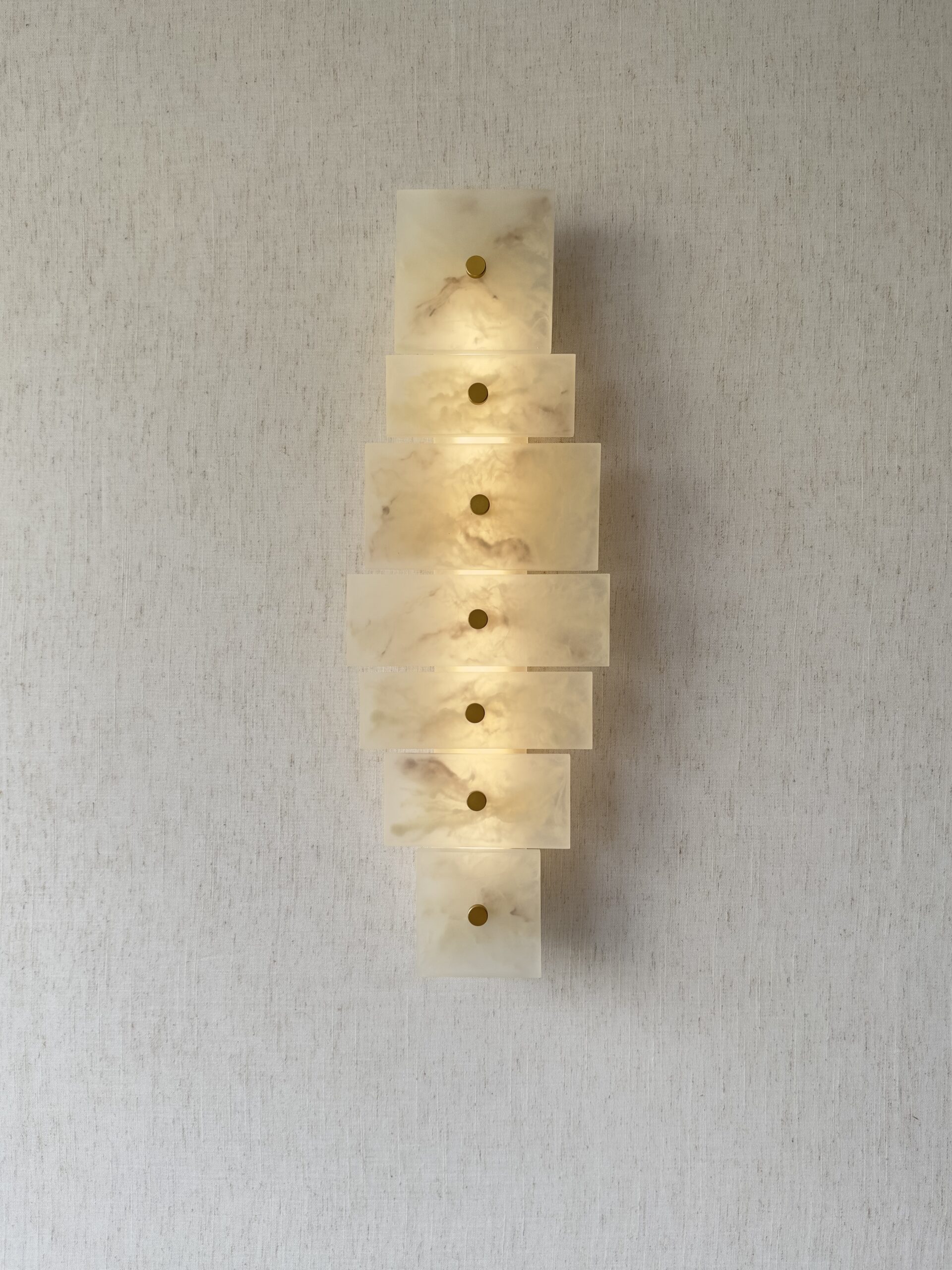 Handmade wireless resin wall sconce with alabaster-inspired finish