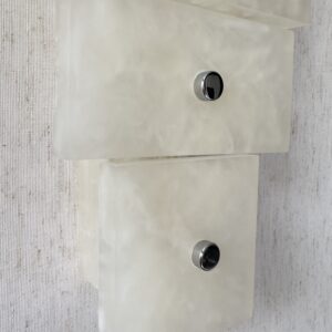 Wireless resin wall sconce with white quartz-inspired finish