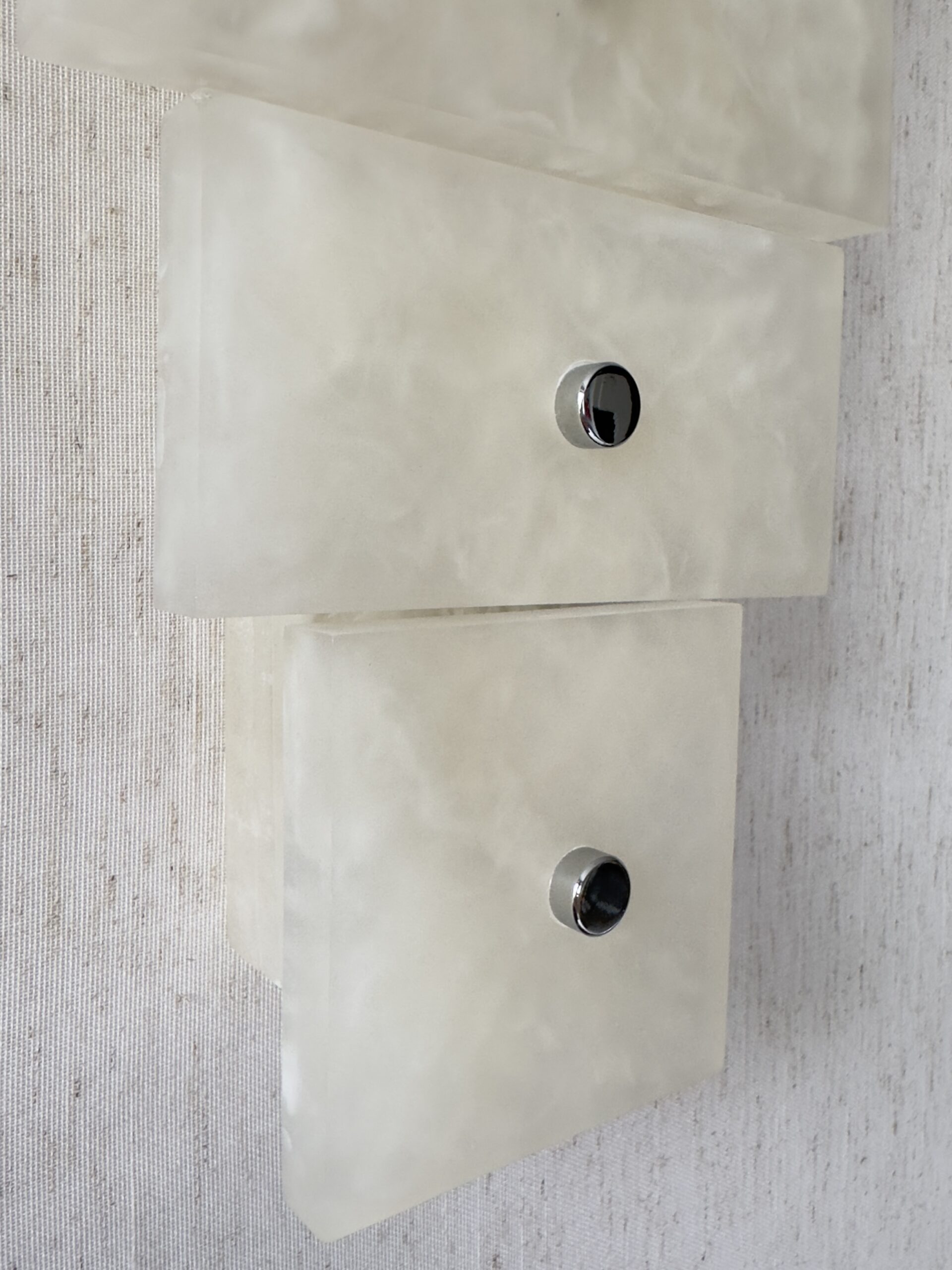 Wireless resin wall sconce with white quartz-inspired finish