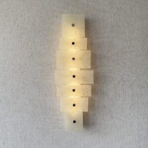 Wireless resin wall sconce with white quartz-inspired finish