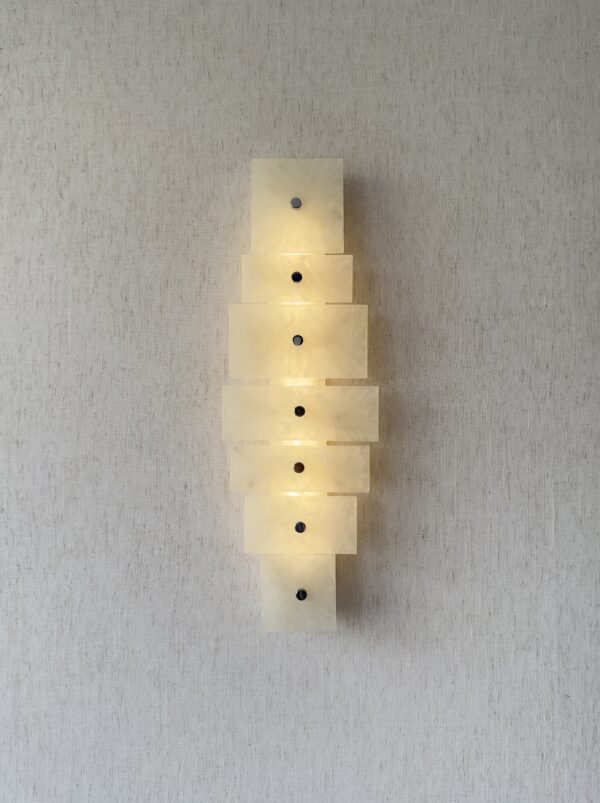 Wireless resin wall sconce with white quartz-inspired finish