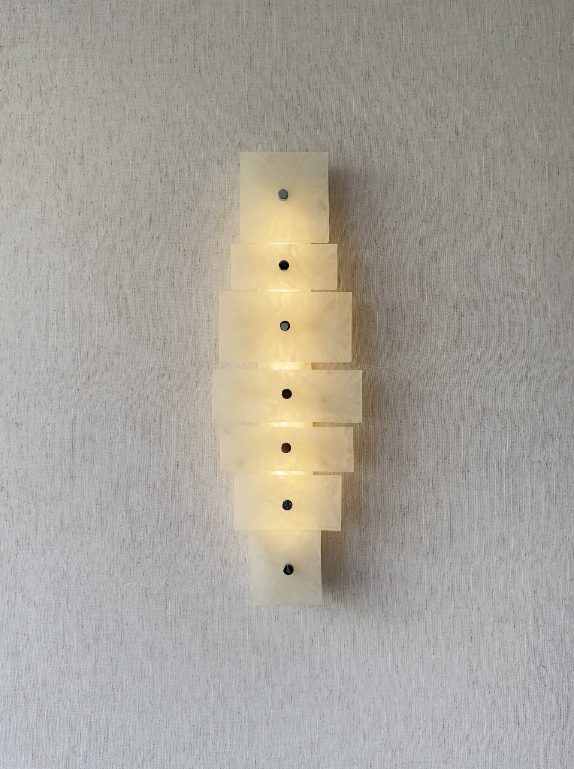 Wireless resin wall sconce with white quartz-inspired finish