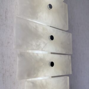 Wireless resin wall sconce with white quartz-inspired finish