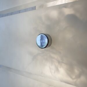 Wireless resin wall sconce with white quartz-inspired finish