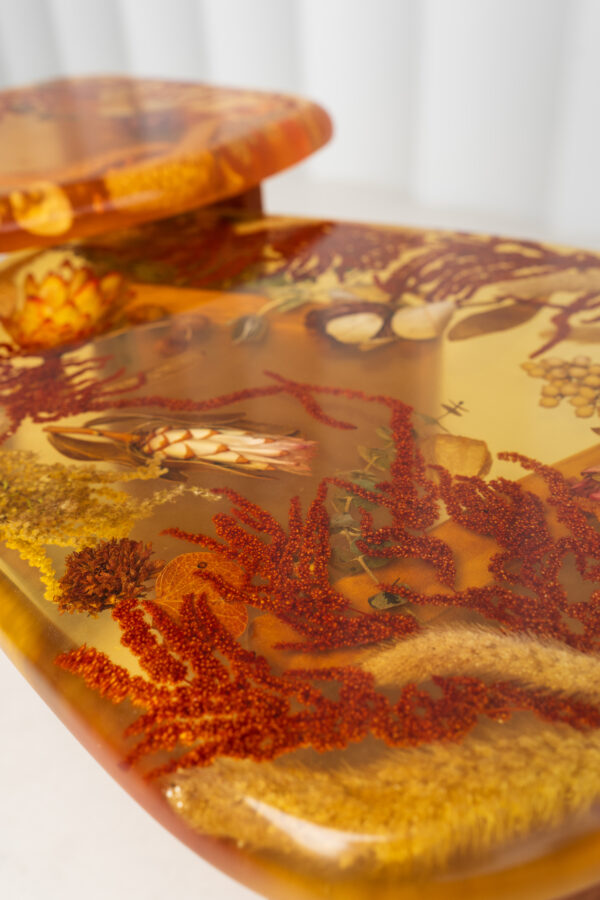 Amber Resin Nesting Coffee Tables with Botanicals and Upholstered legs